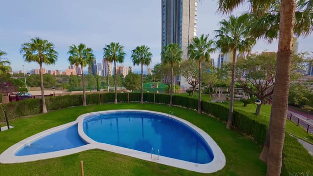 Imagine enjoying a stunning pool view surrounded by tall buildings and lush palm trees in an urban environment