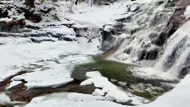 Frozen waterfall and winter snowy forest. Sounds of nature. High quality 4k footage