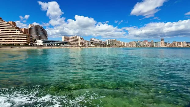 A stunningly beautiful seaside scene showcasing the clear, azure waters and sleek, modern architecture