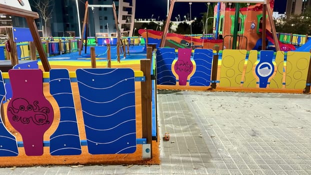 A vibrant playground filled with unique art designs, it is perfect for providing entertainment to children at night