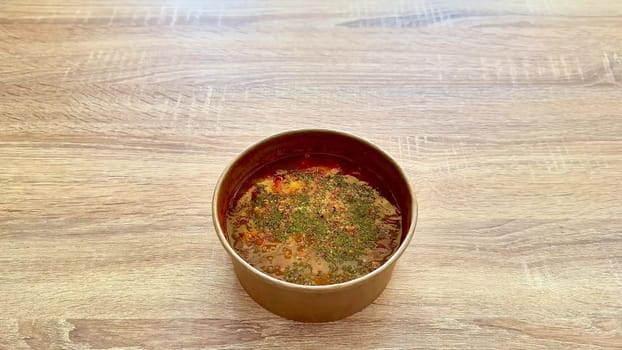 A delicious and flavorful bowl of soup generously topped with fresh herbs, perfect for any meal or occasion