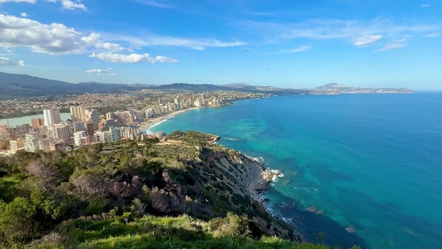 Enjoy stunning coastal views with azure waters and an impressive city skyline from a cliff viewpoint