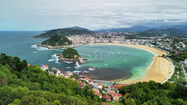 Breathtaking view of La Concha Beach, showcasing its beauty and surrounding hills in San Sebastin