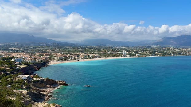 Enjoy a breathtaking aerial view showcasing a pristine coastline with crystalclear turquoise waters and serene beaches