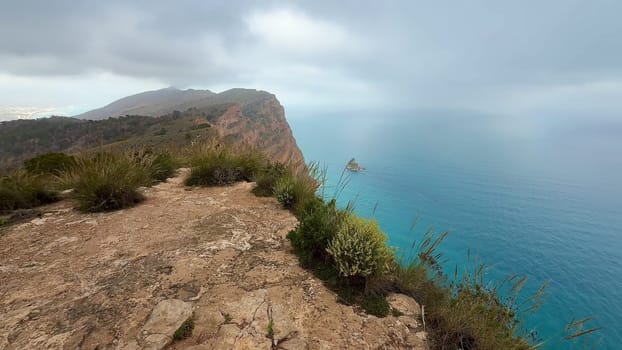 This breathtaking coastal landscape beautifully showcases a stunning view of the serene ocean under the sky