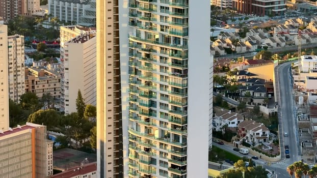 A breathtaking view of a stunning modern skyscraper set against a beautifully picturesque landscape