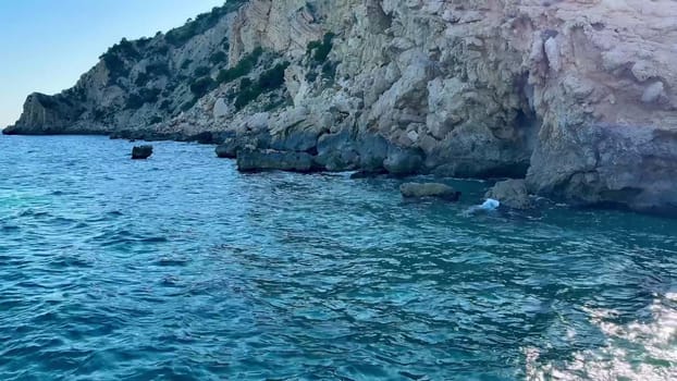 The captivating ocean view showcases pristine turquoise waters and scenic cliffs beneath an expansive bright sky