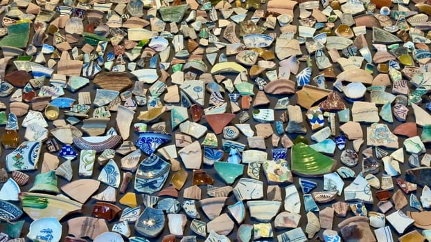 A vibrant and colorful array of ceramic and pottery shards that showcase intricate patterns and textures beautifully