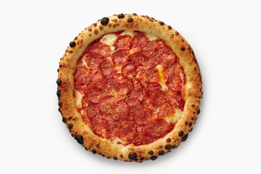 Overhead studio shot of pepperoni pizza with crust bubbles on white background