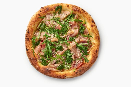 Tasty pizza with parma ham, arugula, pesto sauce and parmesan cheese isolated on white background