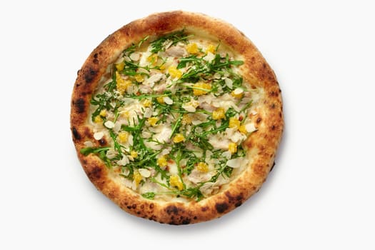 Tasty pizza with grilled chicken, mango, arugula, parmesan, almonds and creamy sauce isolated on white background