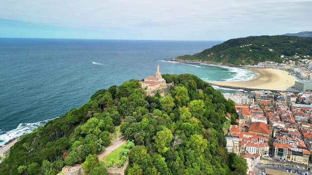 This stunning aerial scene showcases the lush greenery along with a gorgeous beach at the beautiful coastline