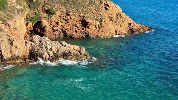 Captivating coastline with rugged cliffs and tranquil turquoise sea, perfect for travel and nature lovers.
