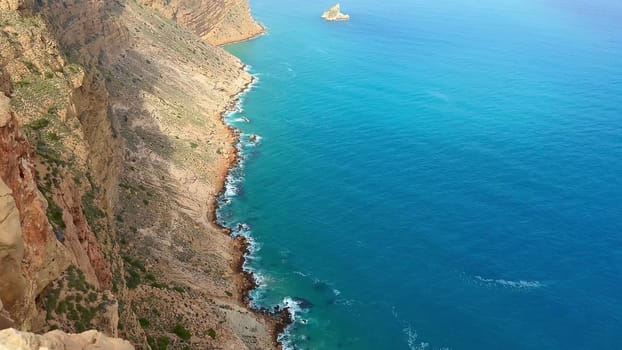 Experience breathtaking coastal cliffs meeting tranquil blue seas, perfect for nature lovers seeking beauty