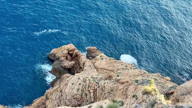 Breathtaking ocean scenes featuring waves forcefully crashing against rugged cliffs and relaxing, tranquil waters