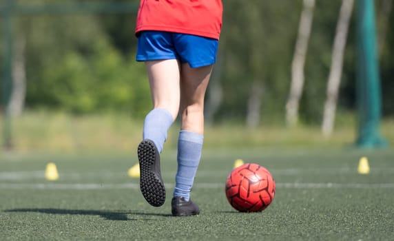 Girl Guides Ball Between Flip Cups At Football Practice, Close-Up View From Behind