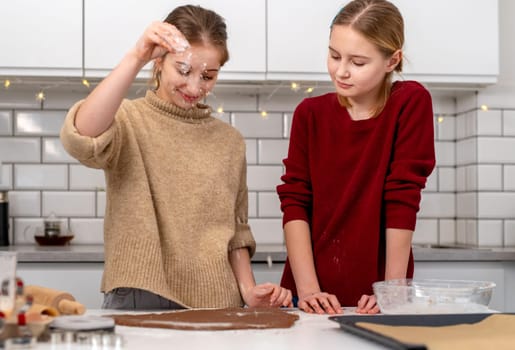 Little Sisters Making Dough For Gingerbread Cookies