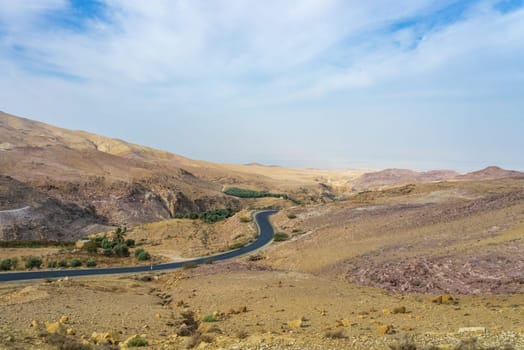 Arid landscape in Jordan on the road from the Dead Sea to Mount Nebo in the desert area of the country
