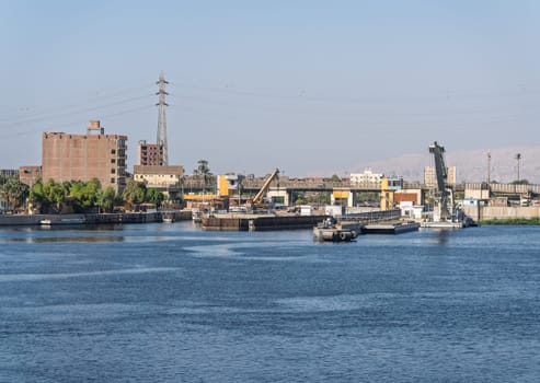 Approaching the new Esna dam and lock on Nile River with gates open for entry