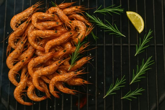 AI generated top view of fresh tiny shrimps grilled over charcoal, perfectly cooked with smoky aroma and crispy texture. Seasoned with salt and black pepper, garnished with rosemary and lemon slices.
