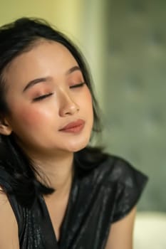 Hangover faces of Indonesian women after drunk in the bedroom lonely