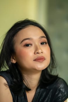 Hangover faces of Indonesian women after drunk in the bedroom lonely