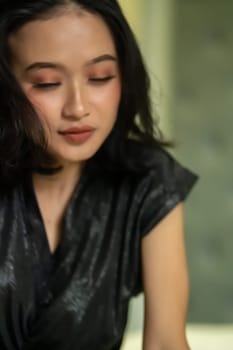 Hangover faces of Indonesian women after drunk in the bedroom lonely