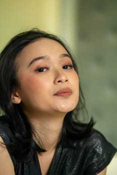 Hangover faces of Indonesian women after drunk in the bedroom lonely