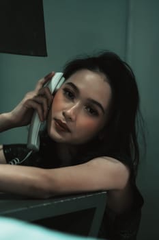 Young Woman on Phone at night in bedroom