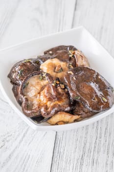 Fragrant shiitake mushrooms fried with thyme and garlic, rich earthy umami aroma