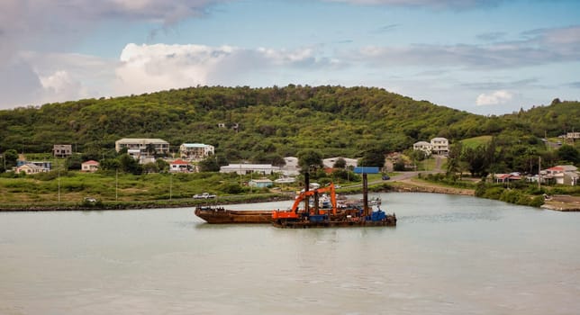 ANTIGUA, WEST INDIES - February 3, 2025: Rusty Barges Moored in Antigua