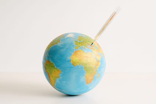 AI generated realistic globe with medical thermometer showing high fever symbolizing global warming and climate crisis concept white background environmental emergency earth protection