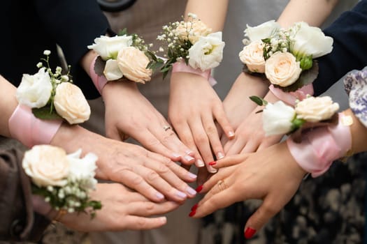 Identical bouquets on ribbon for bridesmaids . bracelets