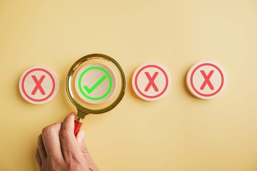 Business choices, man holds magnifying glass considering yes or no. Red question mark hints at difficulty. Hand selects right option. Communication of decision made. Think With Yes Or No Choice.
