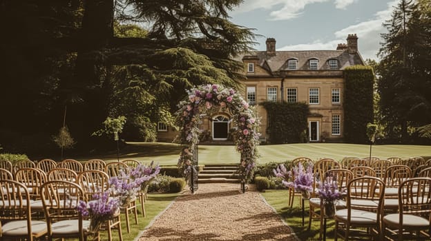 Aisle with wooden chairs and purple lavender floral decorations at an outdoor wedding ceremony in the garden