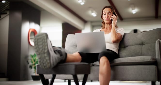 Happy Woman Using Crutches And Laptop In Home Office Setting.