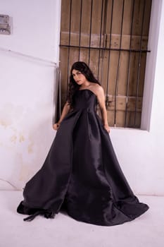 Asian woman standing in the wooden window while wearing a black dress and black hair