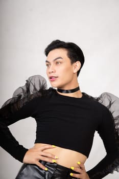 Beautiful Asian man wearing a black dance costume before the performance begins at the backstage