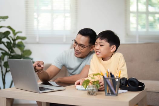A father and son sharing a fun homeschooling experience, engaging with the material and enjoying their time at home.