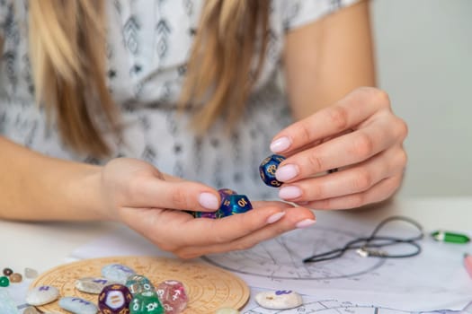 Woman numerologist astrologer counts numbers. Selective focus