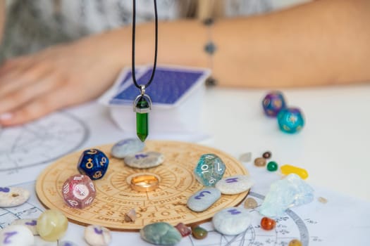 Woman numerologist astrologer counts numbers. Selective focus
