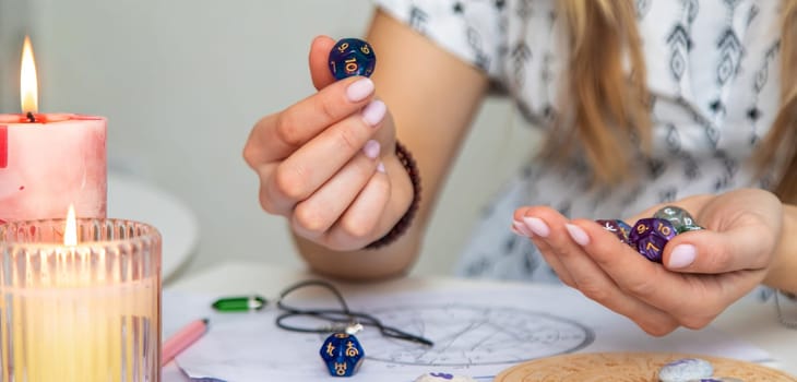 Woman numerologist astrologer counts numbers. Selective focus