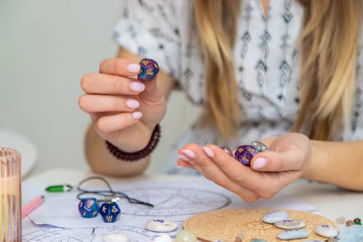 Woman numerologist astrologer counts numbers. Selective focus