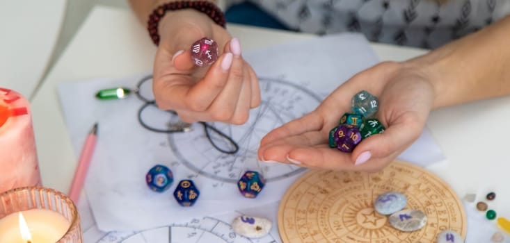Woman numerologist astrologer counts numbers. Selective focus