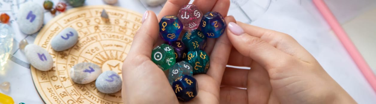 Woman numerologist astrologer counts numbers. Selective focus
