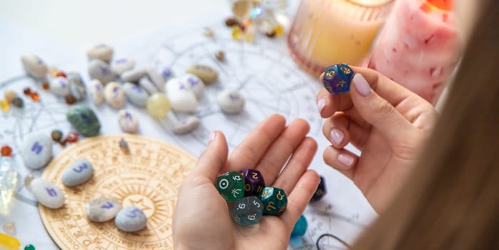 Woman numerologist astrologer counts numbers. Selective focus