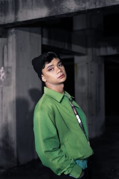 an Asian man wearing a green jacket and black beanie in an old building