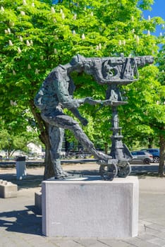 HILVERSUM, NETHERLANDS - MAY 3, 2025: Bronze statue of a camera man at the Hilversum Media Park, produced by Hans Bayens.