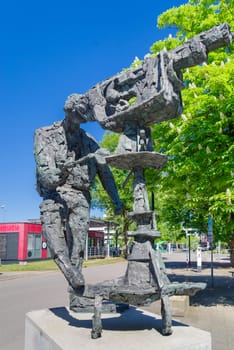 HILVERSUM, NETHERLANDS - MAY 3, 2025: Bronze statue of a camera man at the Hilversum Media Park, produced by Hans Bayens.