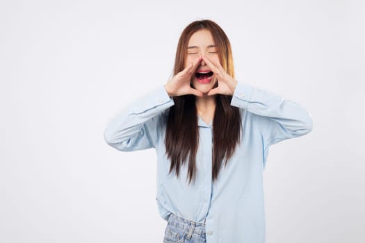 Announcement begins as woman cups hands around her mouth and another woman prepares to shout news, both expressing urgency and emotion isolated on white backdrop.